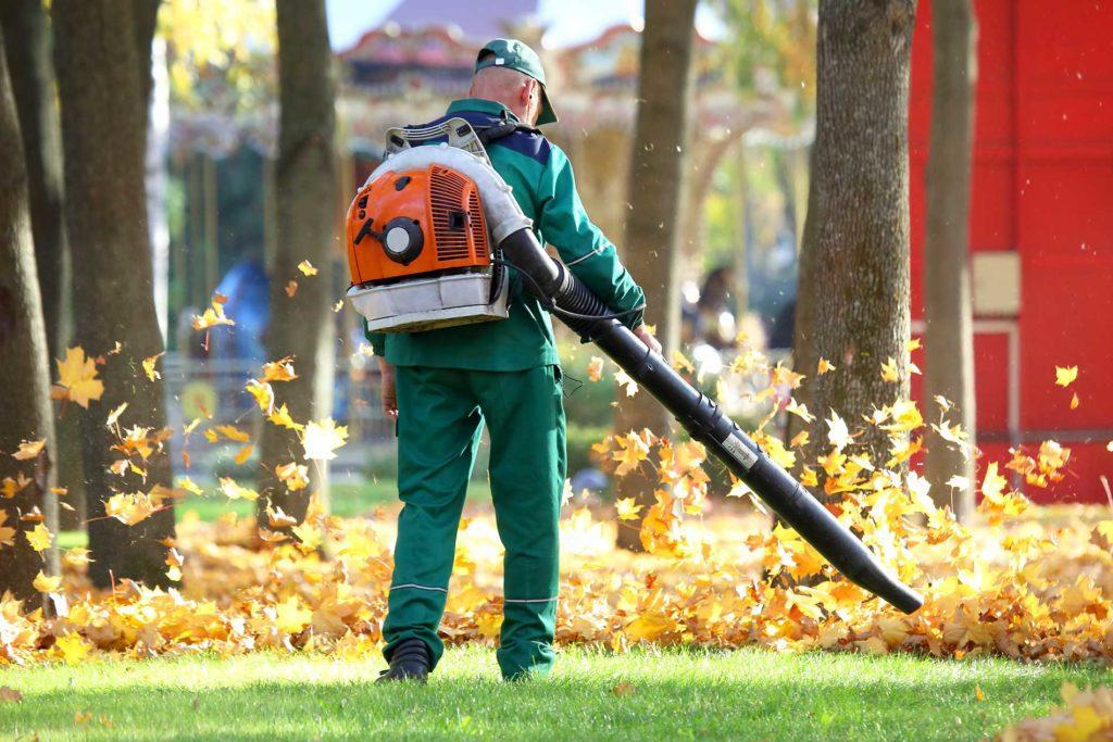 man-blowing-leaves-away-with-leaf-blower